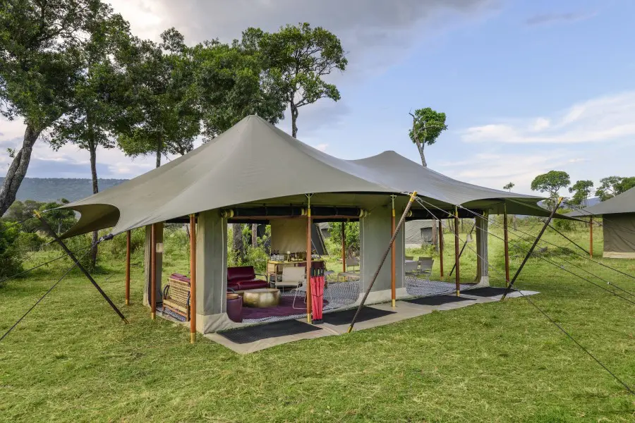 A seasonal mobile tented camp pitched on open grassland in the Serengeti,